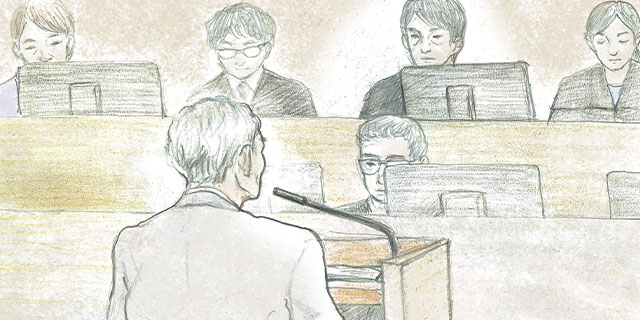 グレーのジャケットを羽織り公判に臨んだ吉田友貞被告（画：Minami）